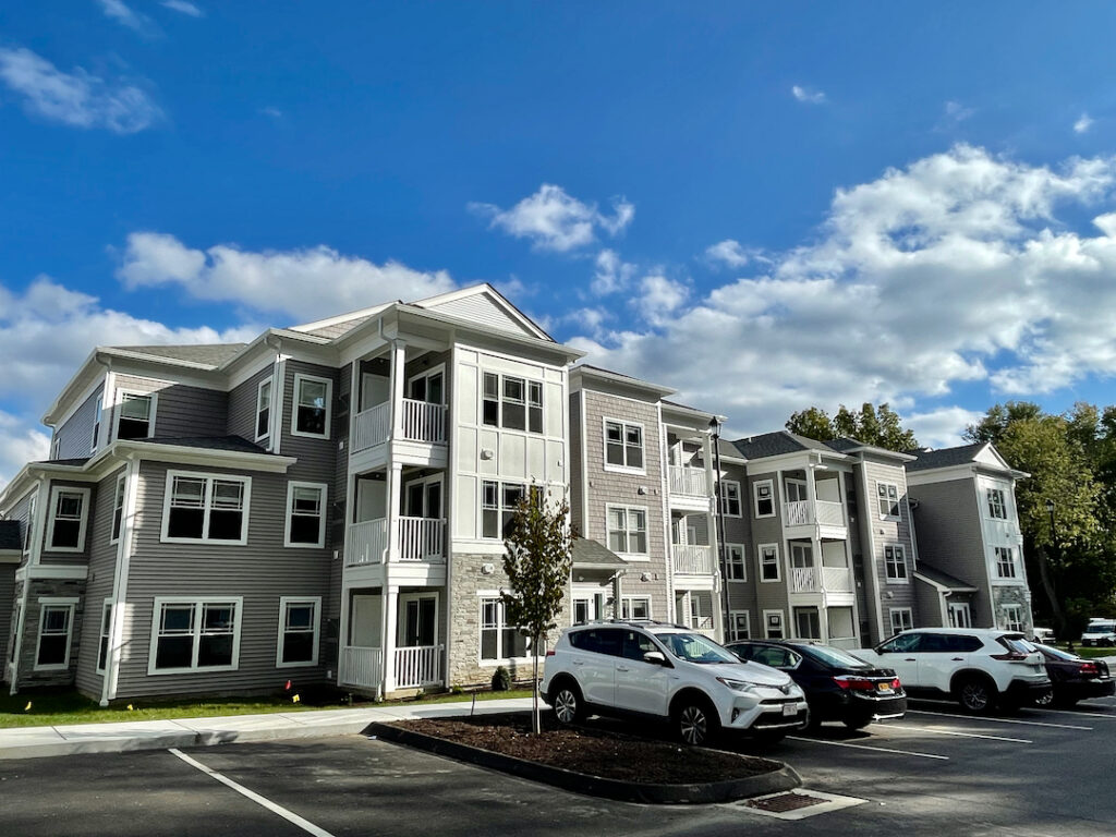 building from with white accent panels Westledge Apartments